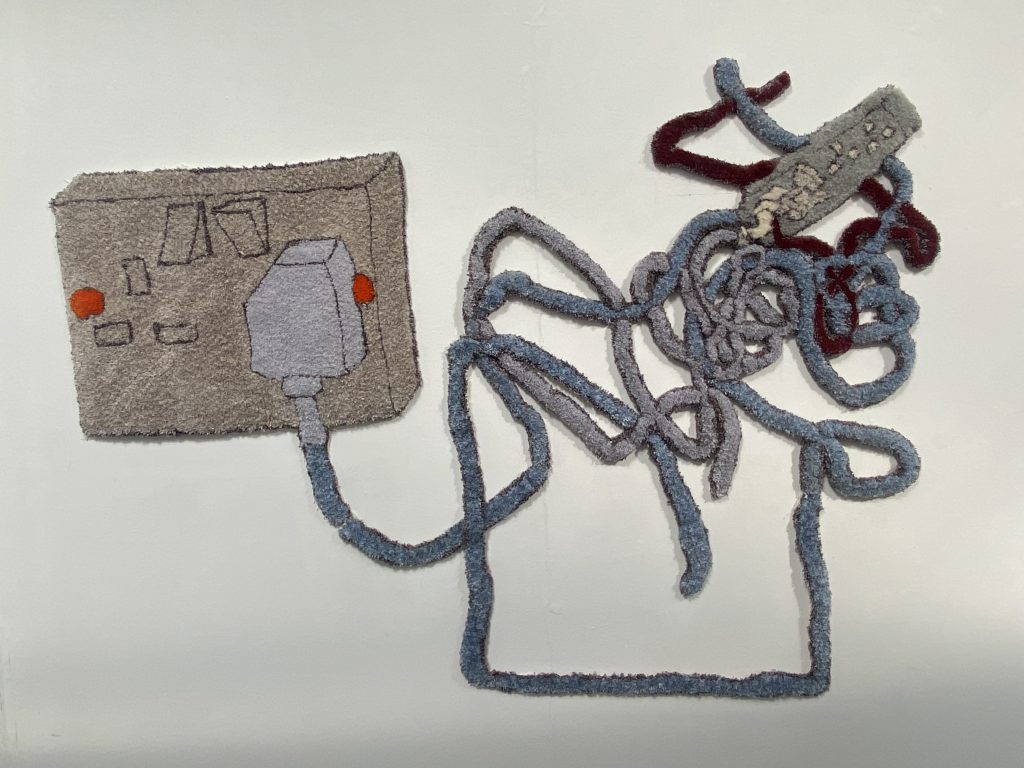 Plugs, cables and sockets in a tufted work